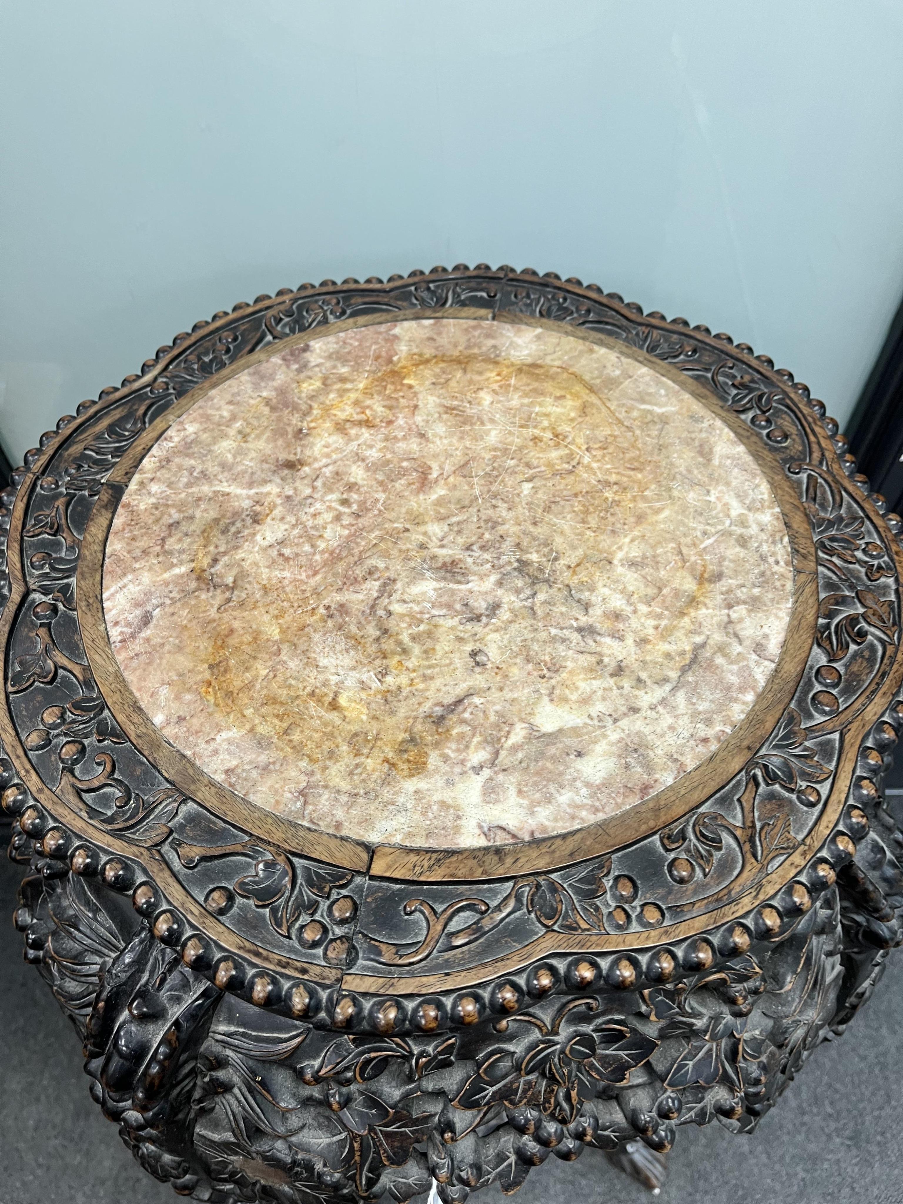 A Chinese carved hongmu rouge marble topped vase stand, diameter 42cm, height 93cm